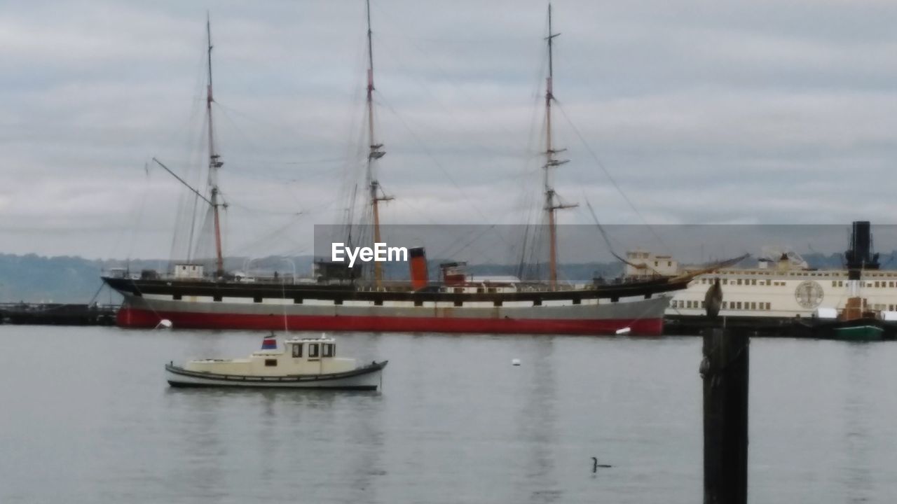 BOATS MOORED IN HARBOR