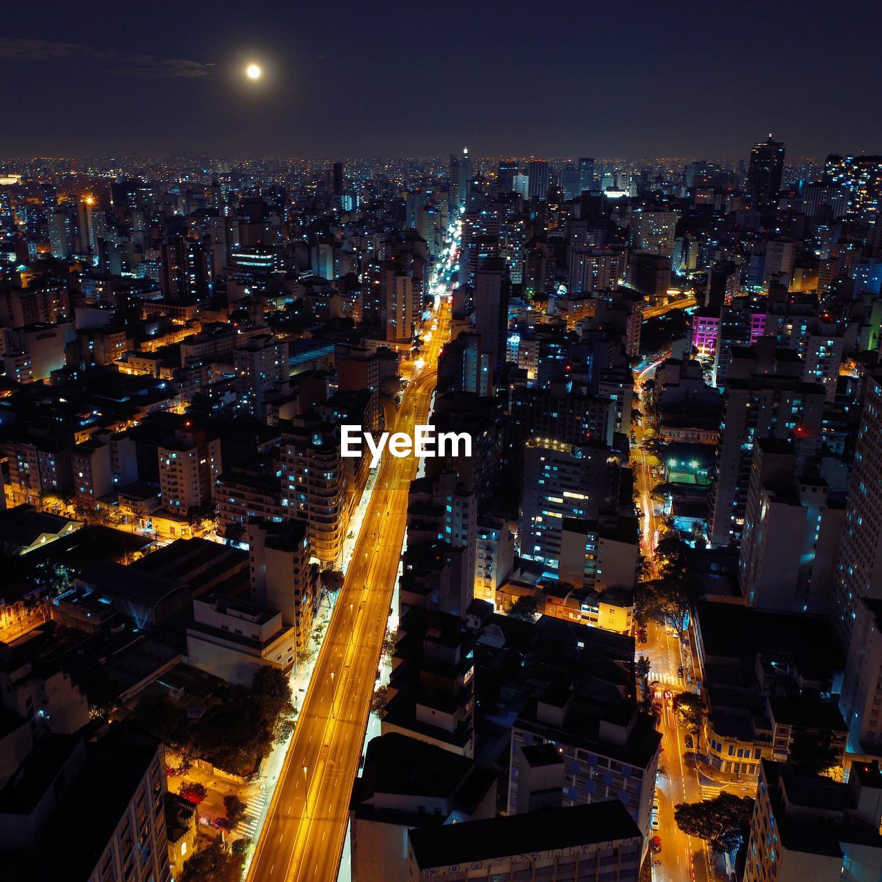 High angle view of illuminated city buildings at night