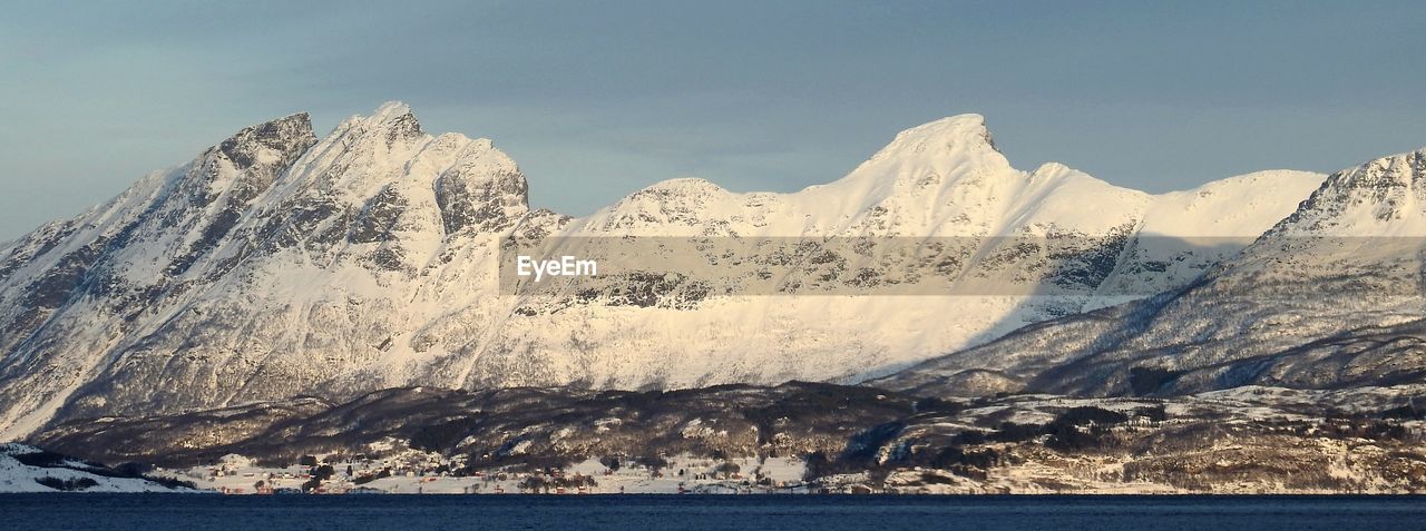 Scenic view of snowcapped mountains against sky