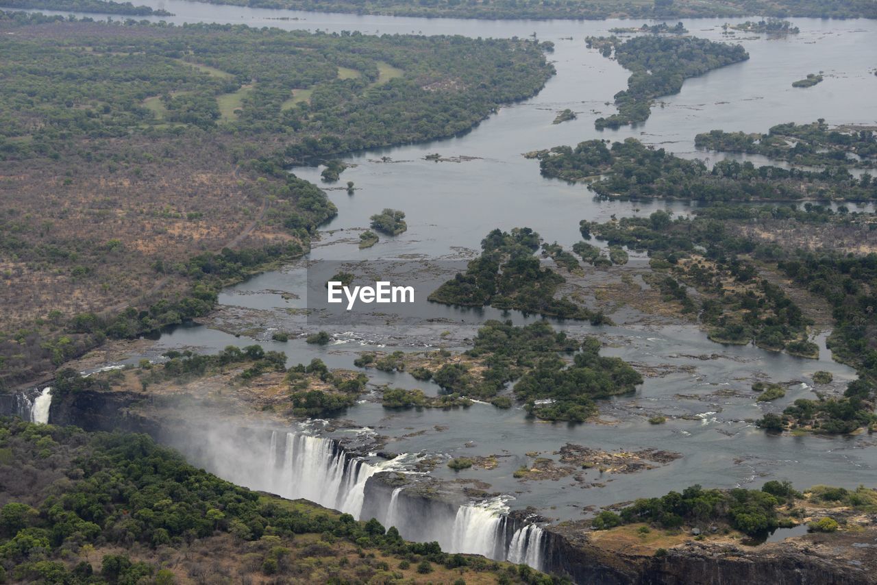 HIGH ANGLE VIEW OF RIVER AGAINST SKY