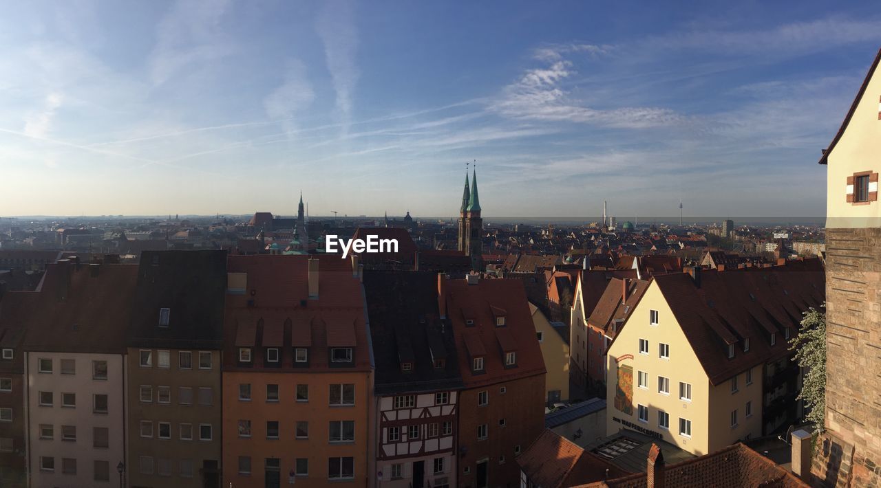 HIGH ANGLE VIEW OF BUILDINGS AGAINST SKY