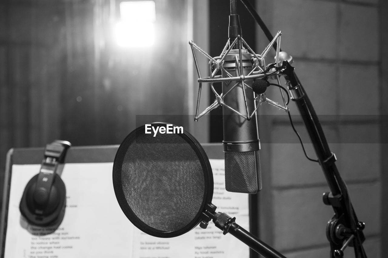 Close-up of microphone with soundproof in recording studio