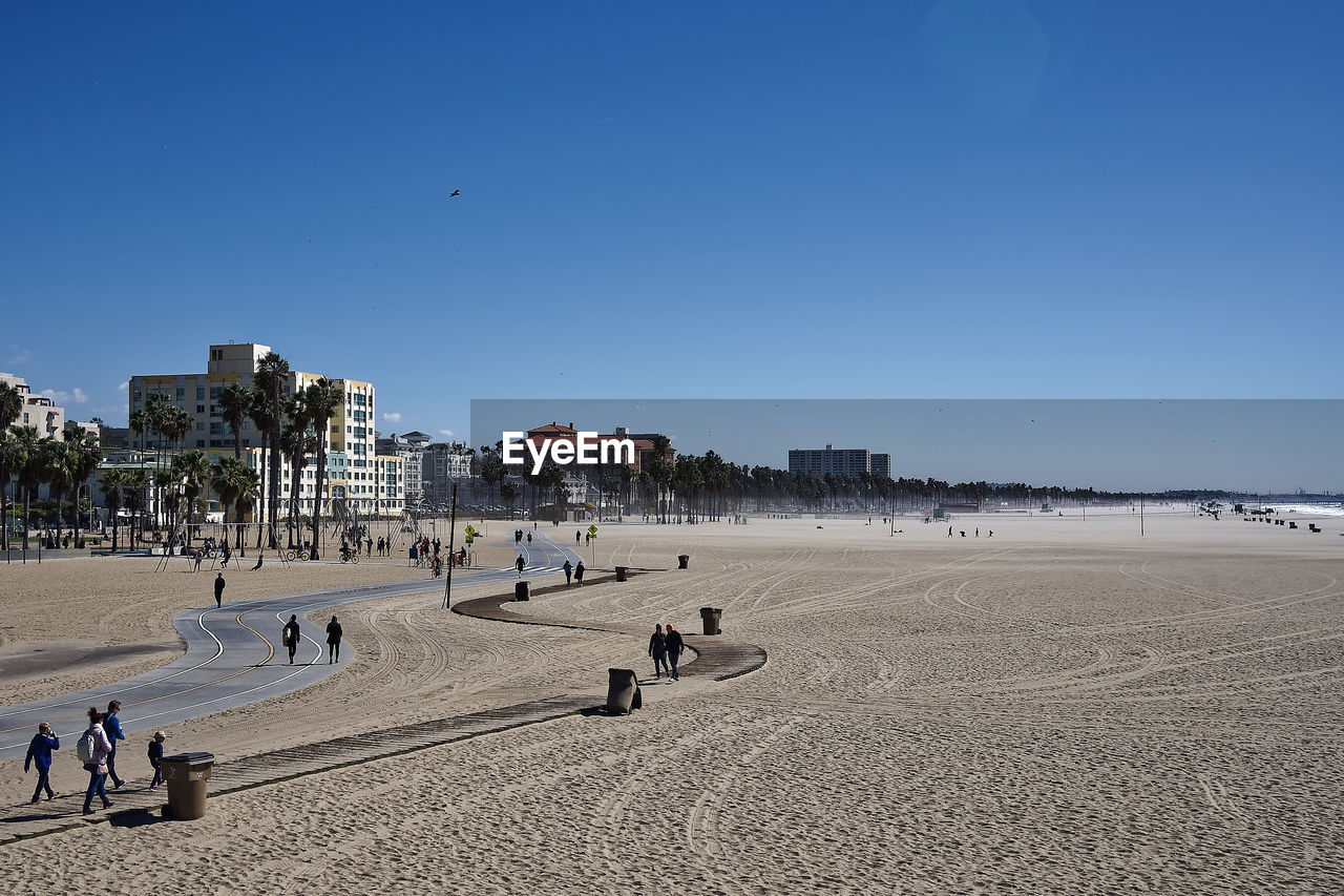 PANORAMIC VIEW OF BEACH AGAINST CLEAR BLUE SKY