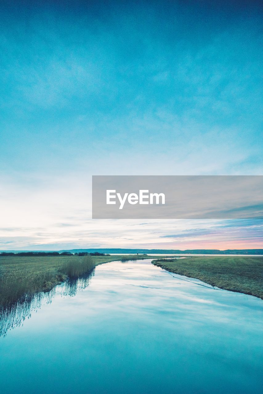 Scenic view of sea against blue sky