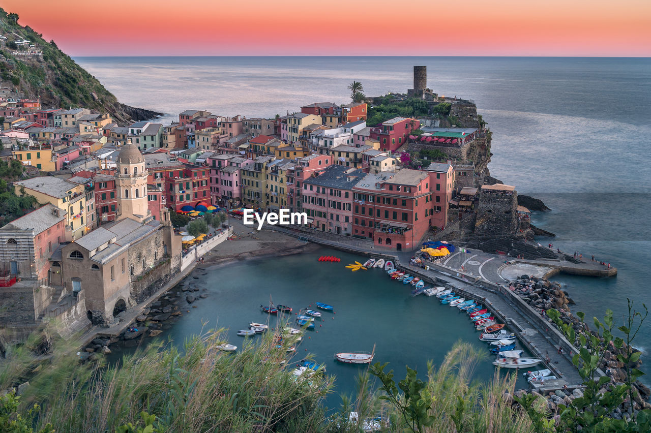 High angle view of townscape by sea