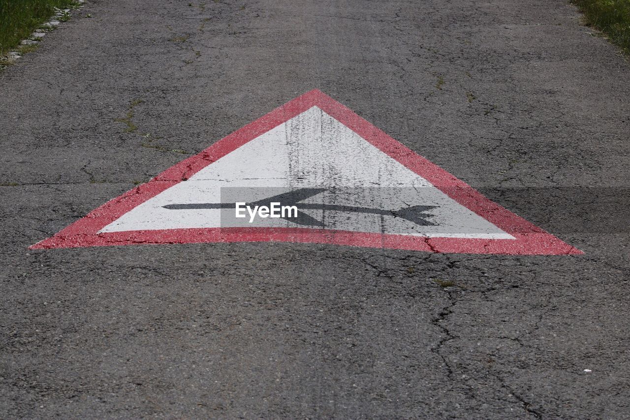 High angle view of road sign on street