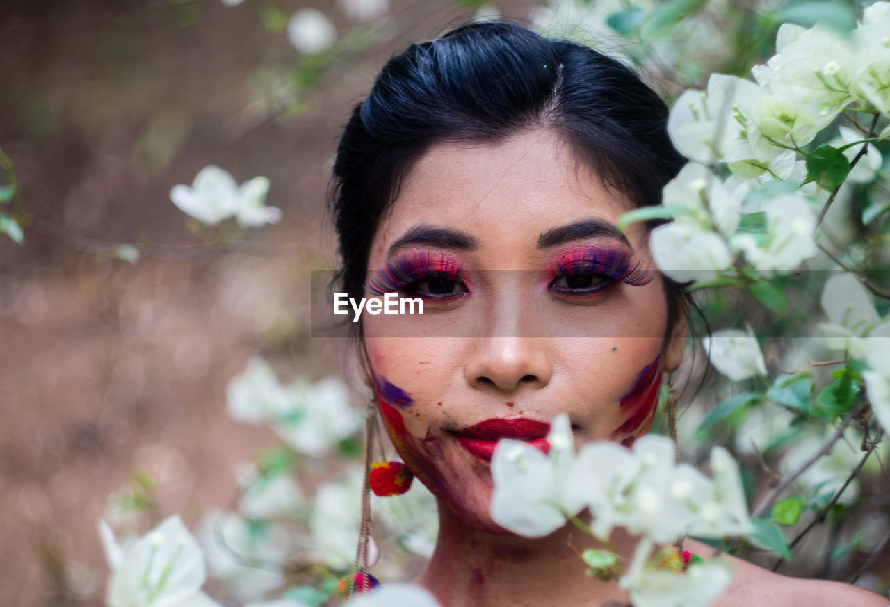 Portrait of woman with face paint