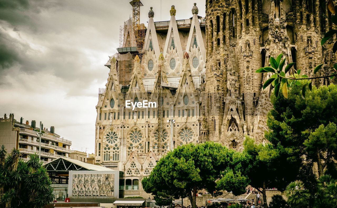 Low angle view of sagrada familia in city