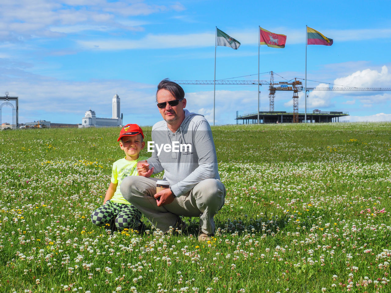 Father with son on grassy field