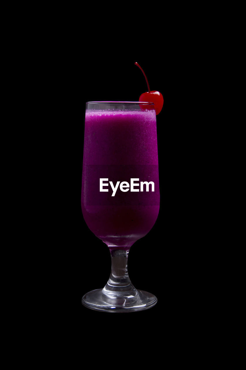 Close-up of drink against black background