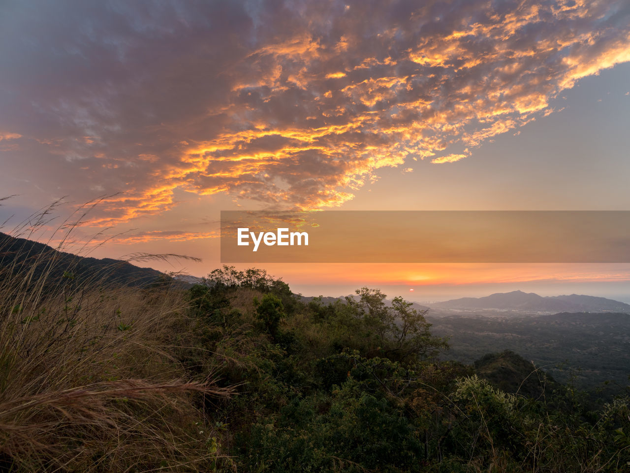 SCENIC VIEW OF MOUNTAINS DURING SUNSET