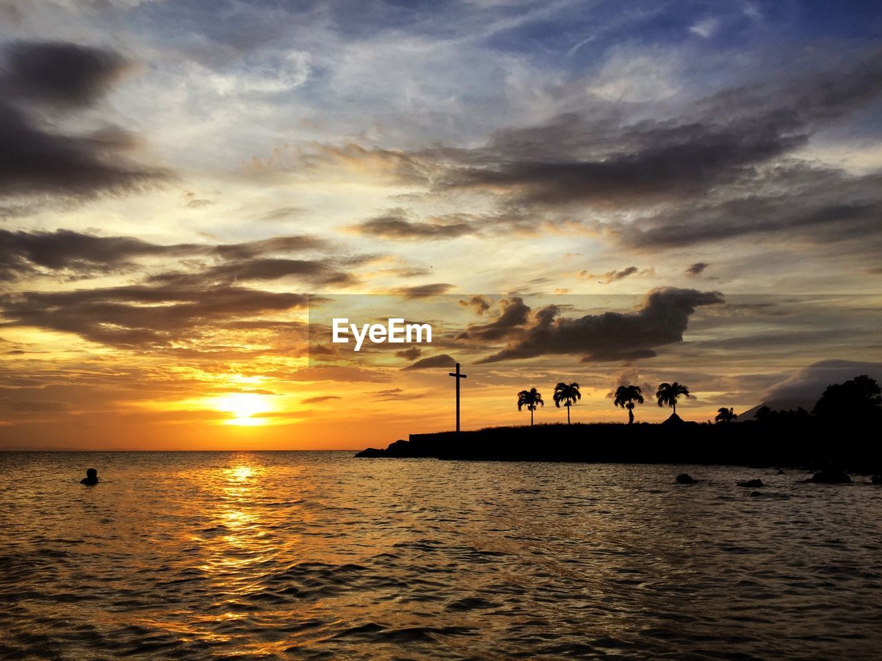 Scenic view of sea against sky at sunset