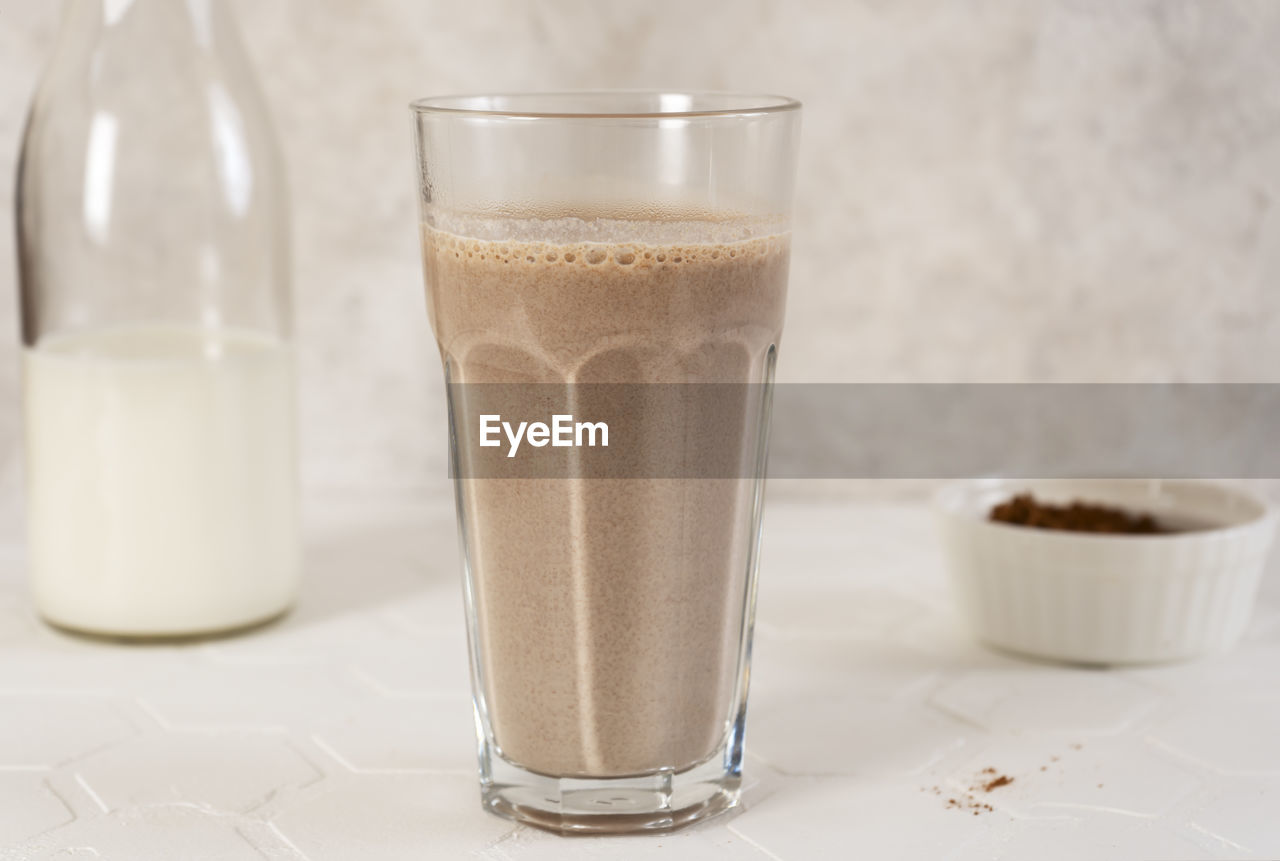 Delicious homemade cocoa drink with milk and cocoa powder. horizontal orientation.