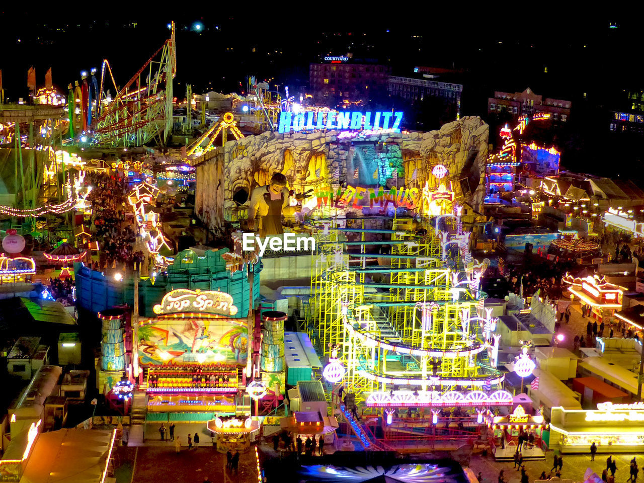 ILLUMINATED CAROUSEL IN AMUSEMENT PARK