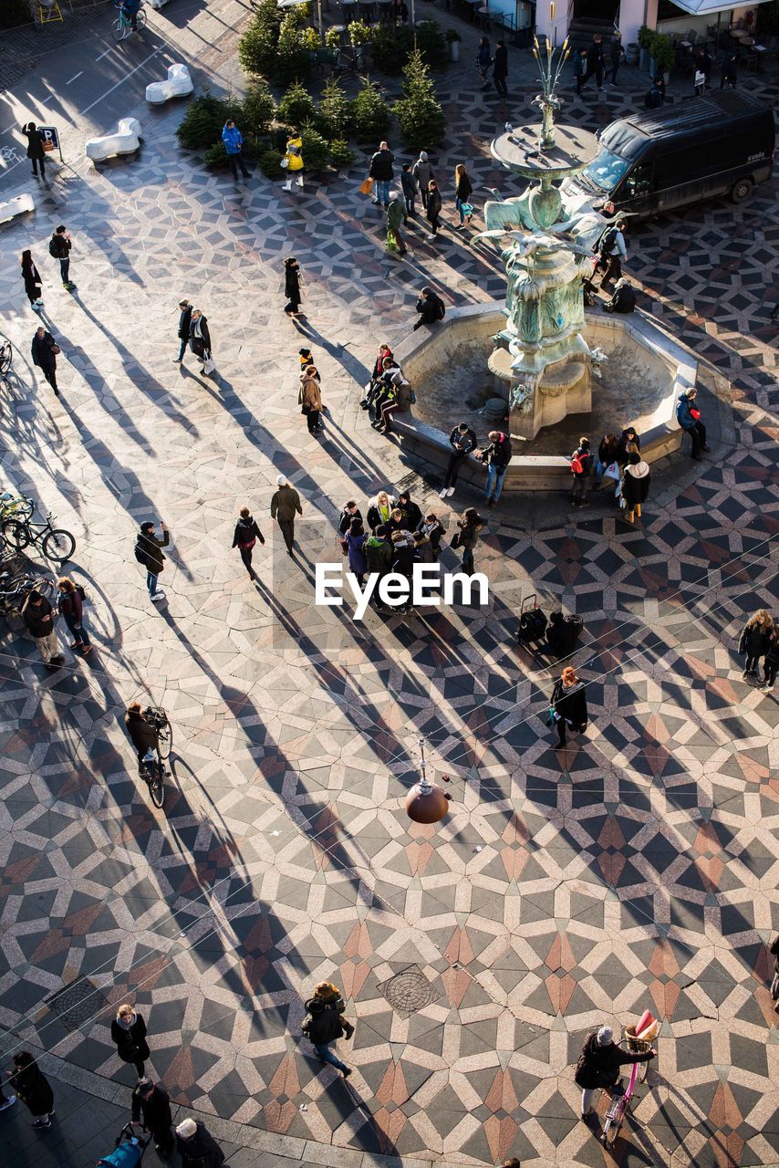 HIGH ANGLE VIEW OF PEOPLE ON STREET