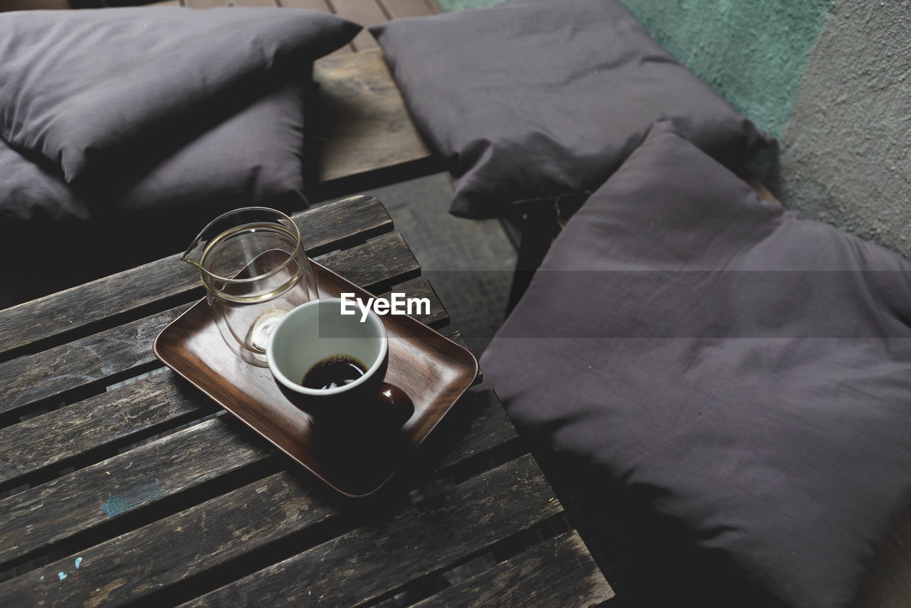 High angle view of coffee in cup on table