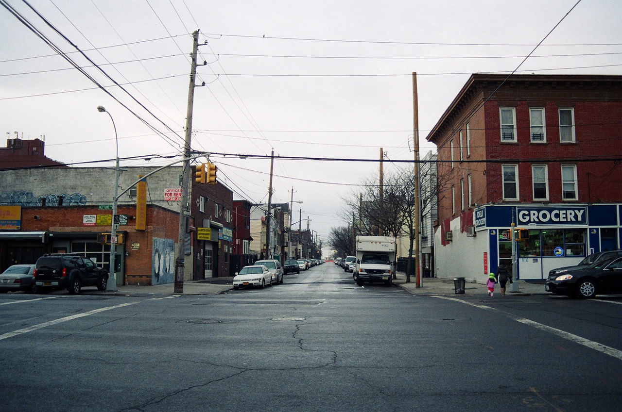 CARS ON STREET IN CITY