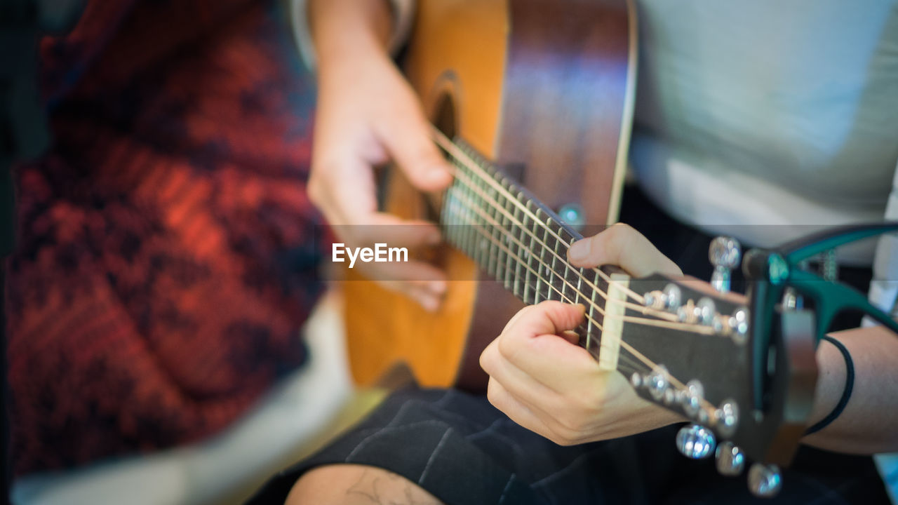 Woman playing guitar