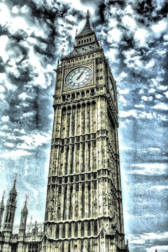 LOW ANGLE VIEW OF TOWER AGAINST CLOUDY SKY