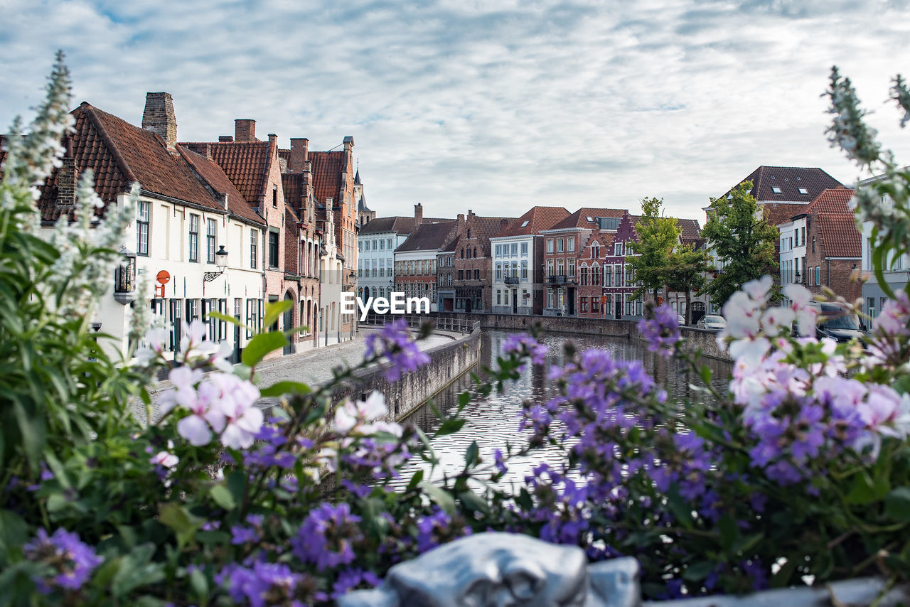 Canal amidst buildings in city