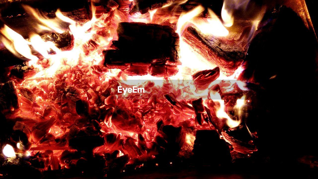 CLOSE-UP OF FIRE IN THE DARK