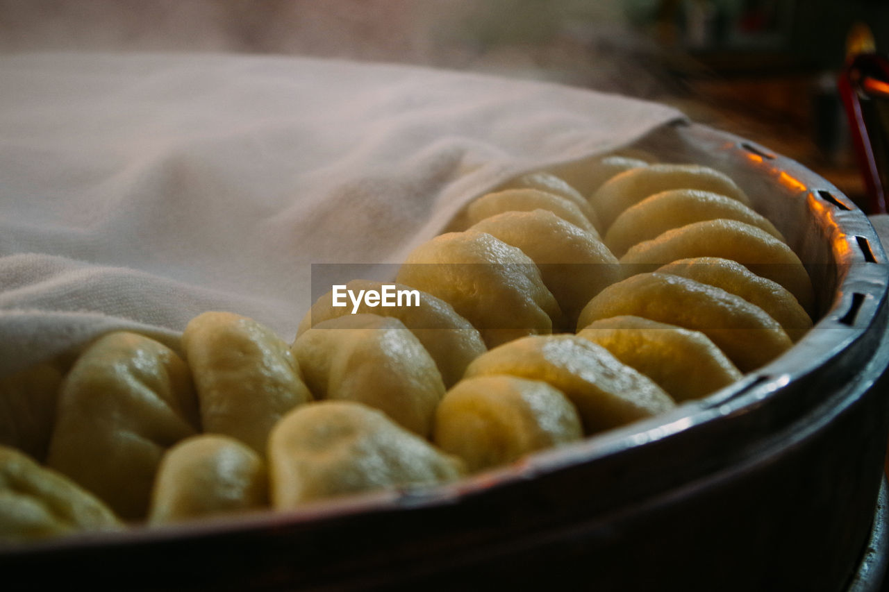 Close-up of chinese dumplings in wooden container