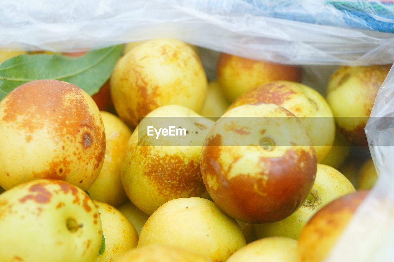 HIGH ANGLE VIEW OF FRUITS FOR SALE AT MARKET STALL