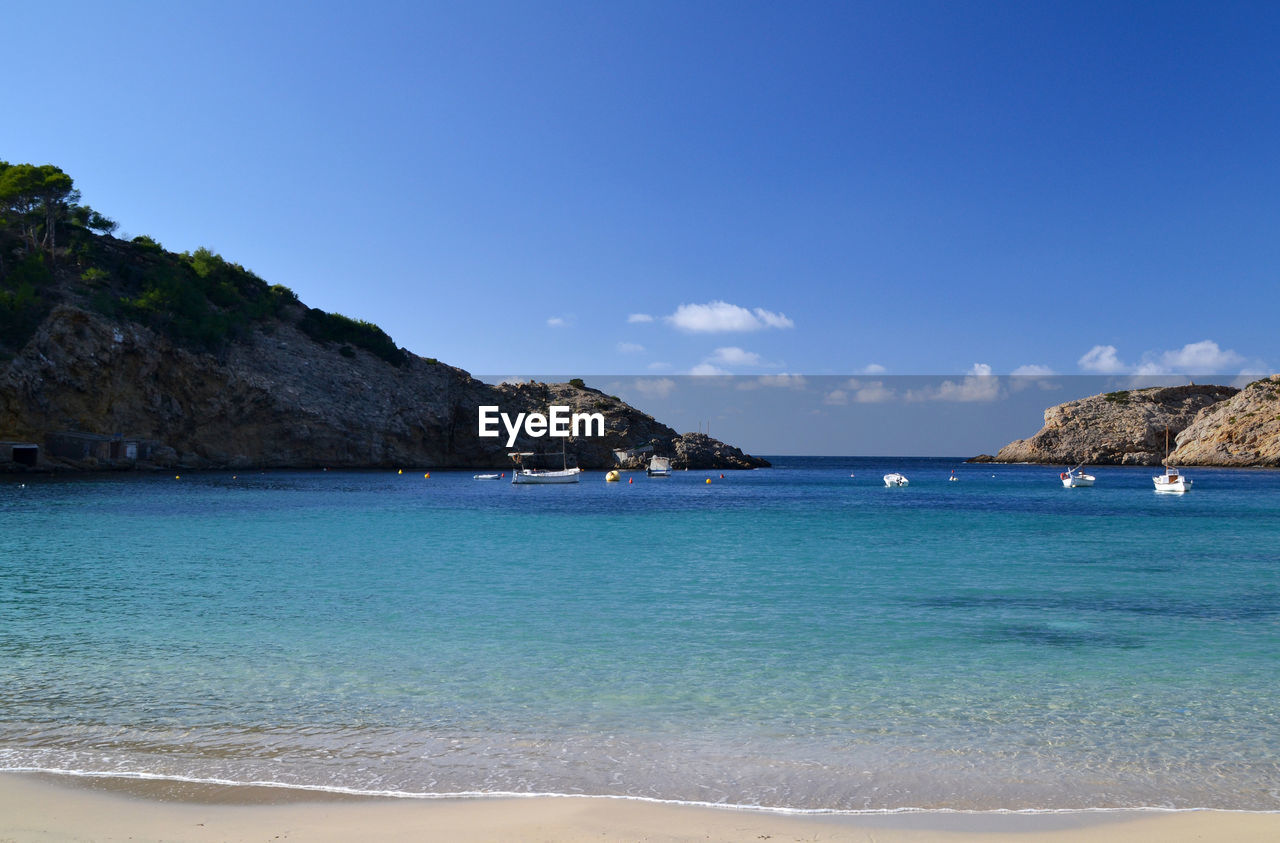 Scenic view of sea against blue sky