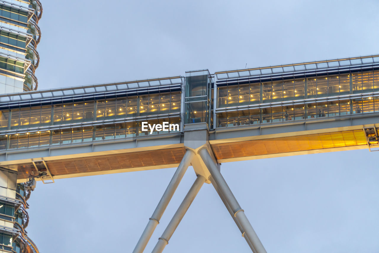 LOW ANGLE VIEW OF RAILROAD BRIDGE AGAINST SKY