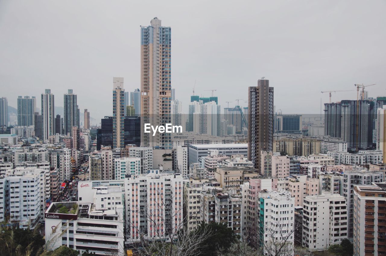 Modern buildings in city against sky