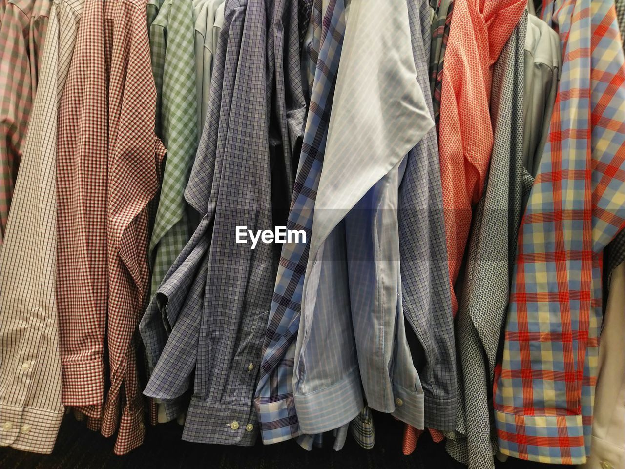 Full frame shot of multi colored shirts hanging on rack