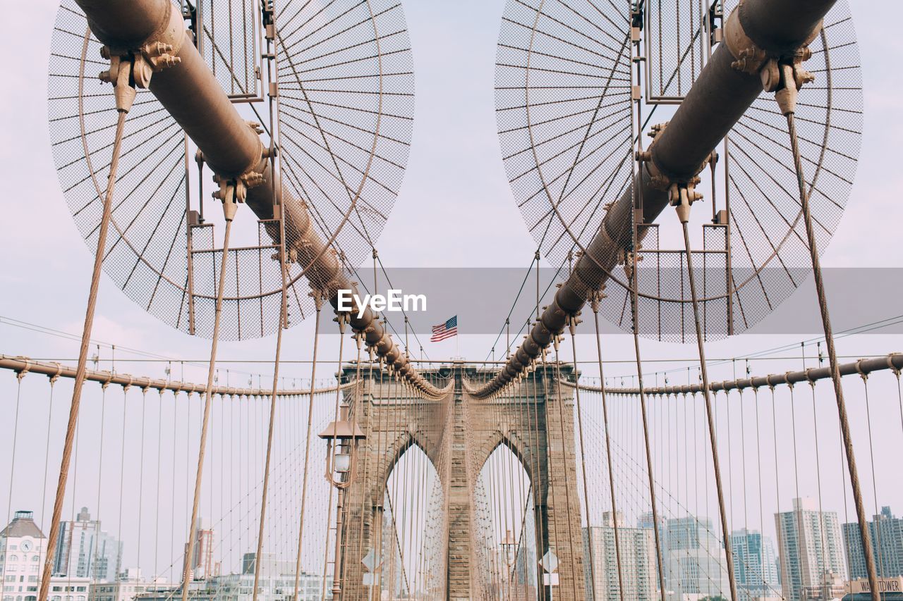 Brooklyn bridge in city against sky