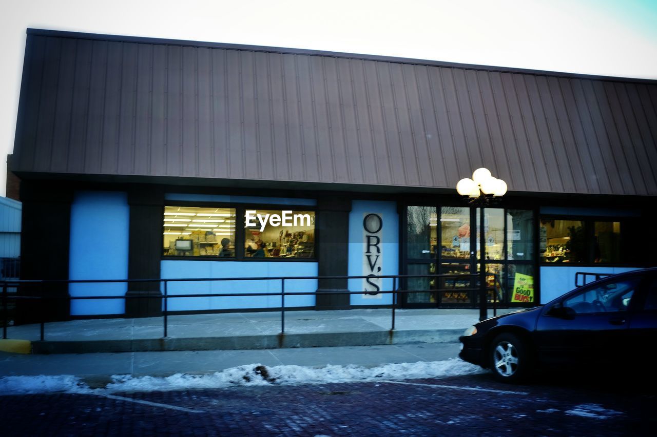 Grocery store in city at dusk