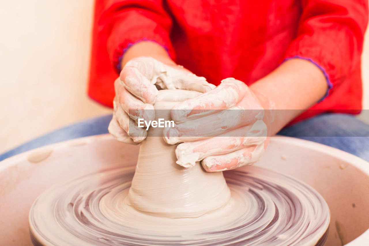 Girl working on pottery wheel