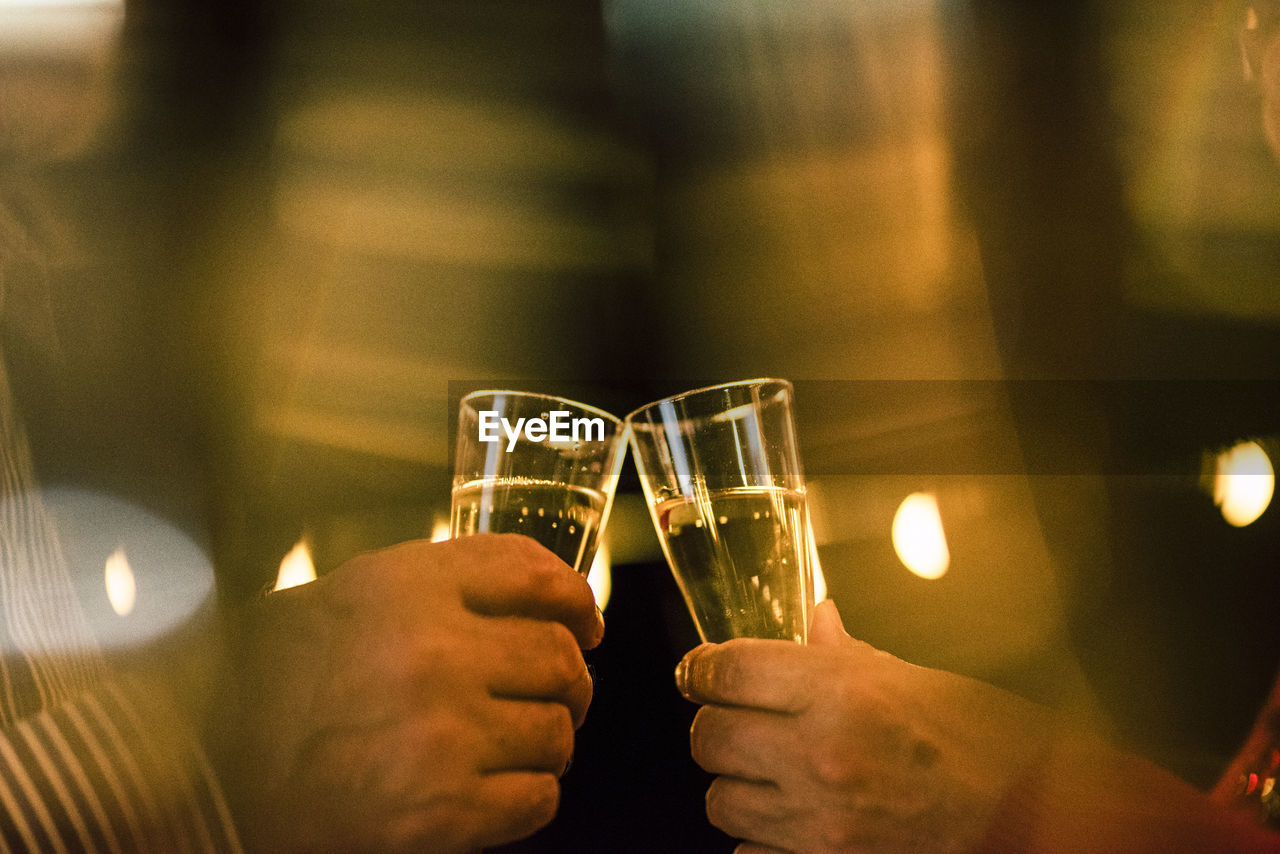 HIGH ANGLE VIEW OF PEOPLE IN WINEGLASS