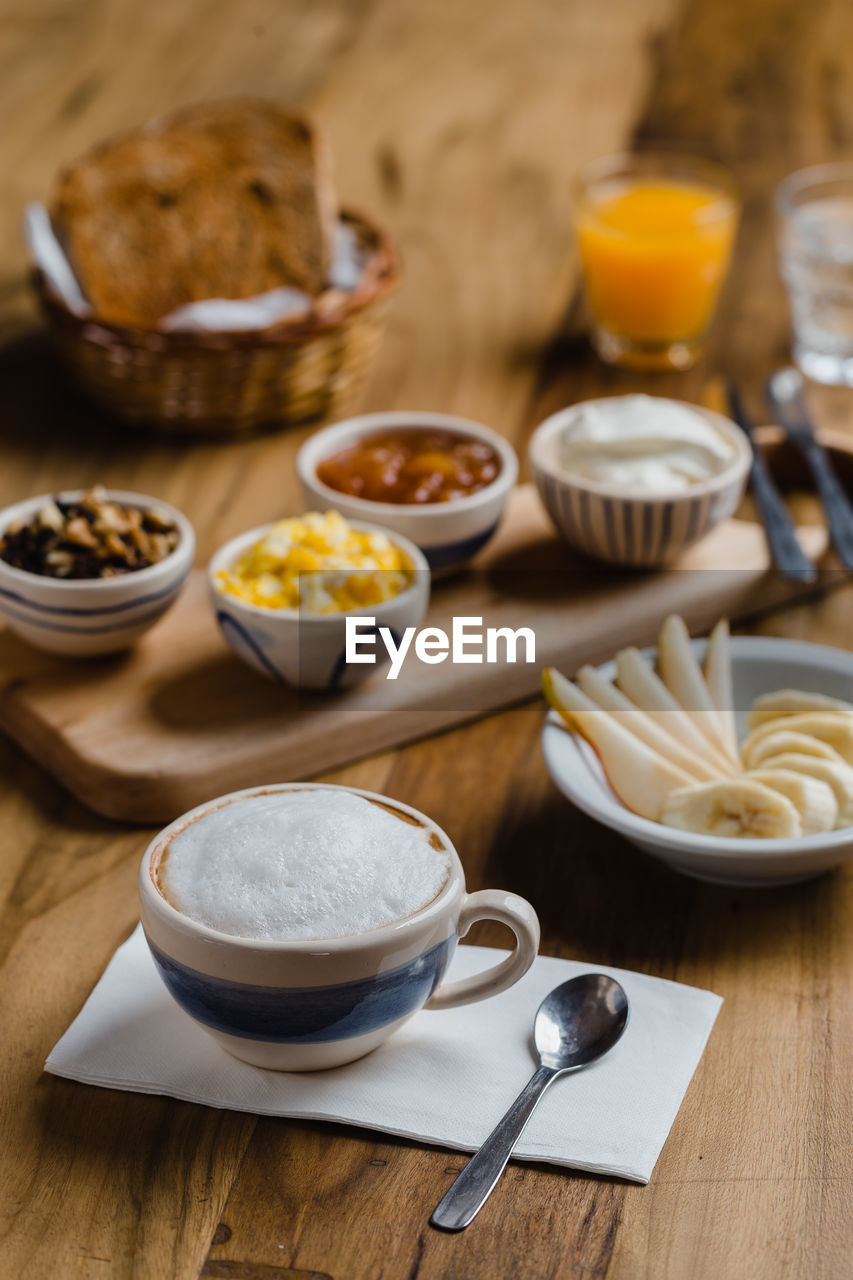 HIGH ANGLE VIEW OF FOOD SERVED ON TABLE AT KITCHEN