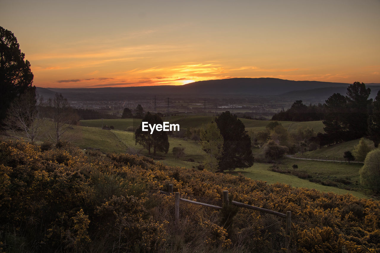 SCENIC VIEW OF LANDSCAPE DURING SUNSET