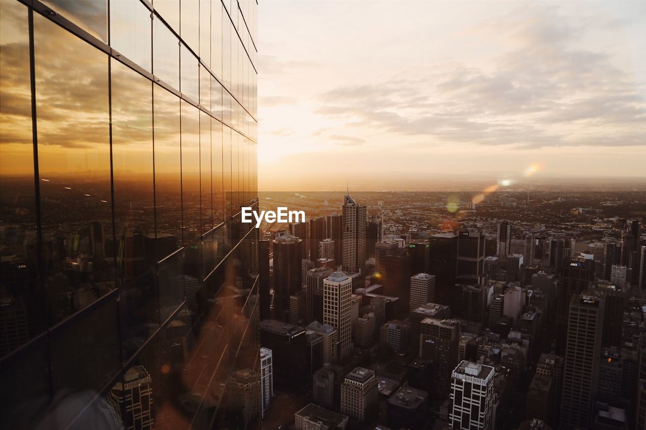 VIEW OF CITYSCAPE AT SUNSET