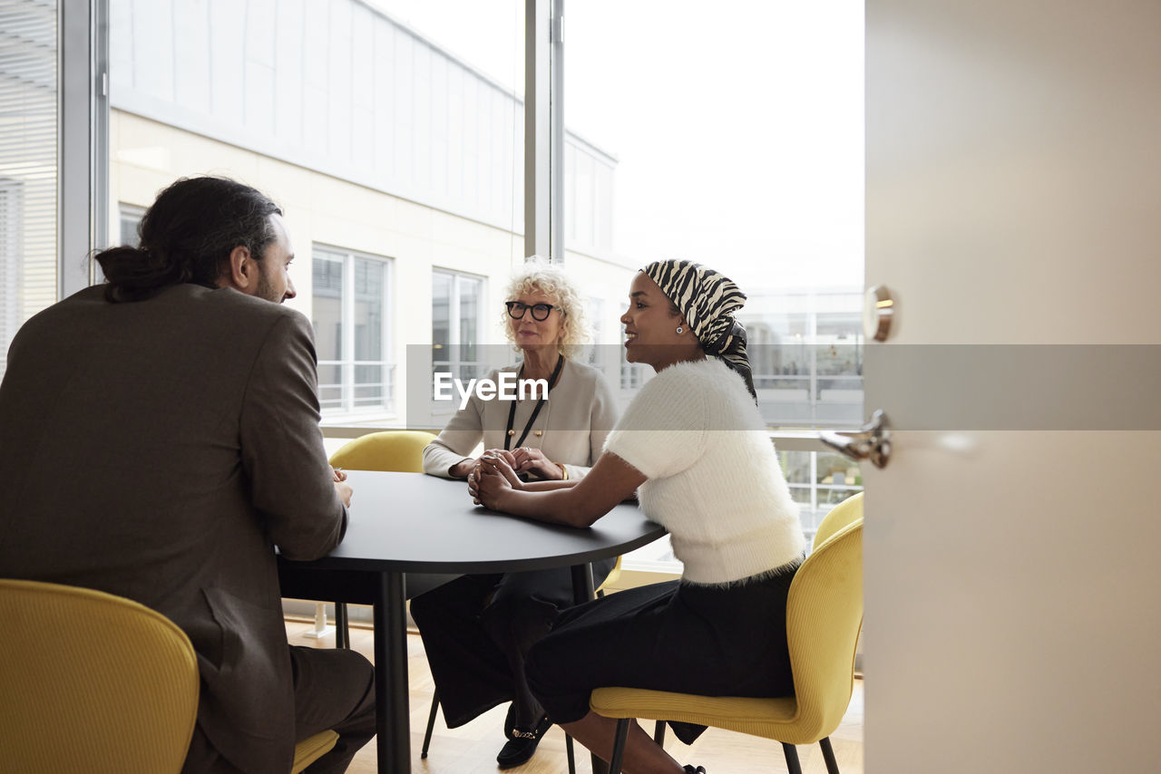 People talking during business meeting