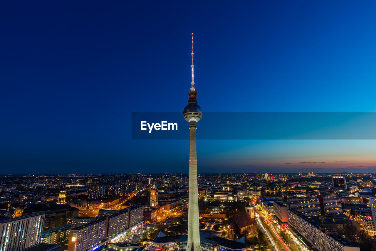 Berlin tv tower at sunset against blue sky