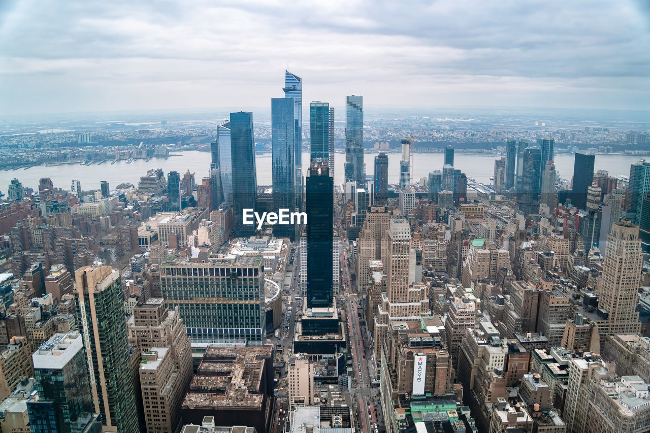 Aerial view of cityscape against sky