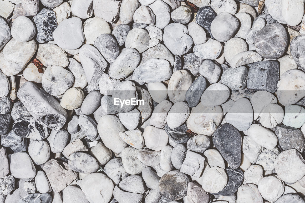 HIGH ANGLE VIEW OF STONES ON STONE