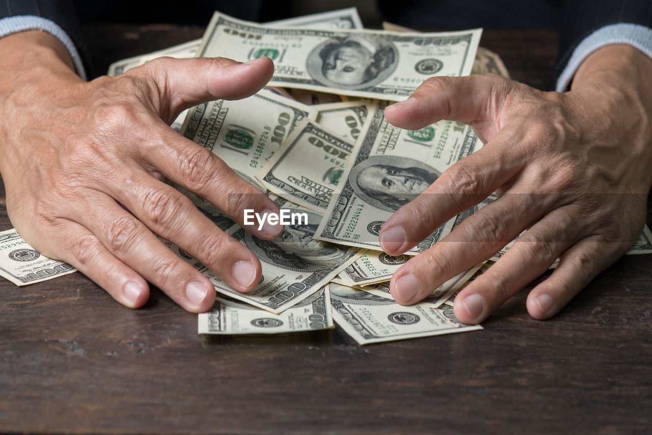 Close-up of a person with a load of money