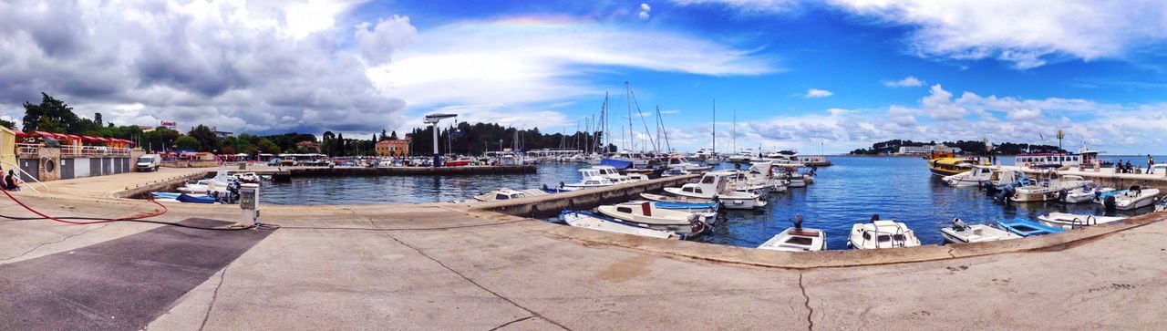 Boats moored at harbor