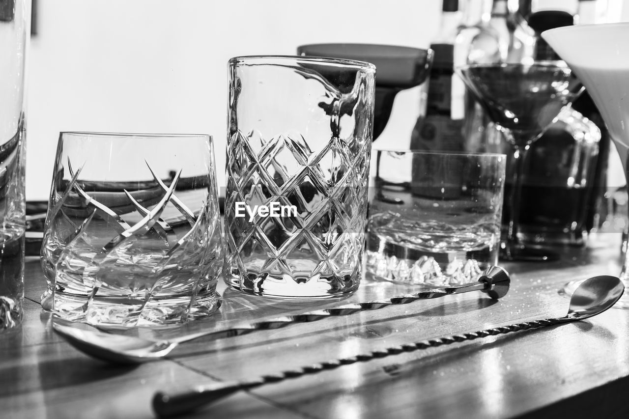 CLOSE-UP OF GLASSES ON TABLE