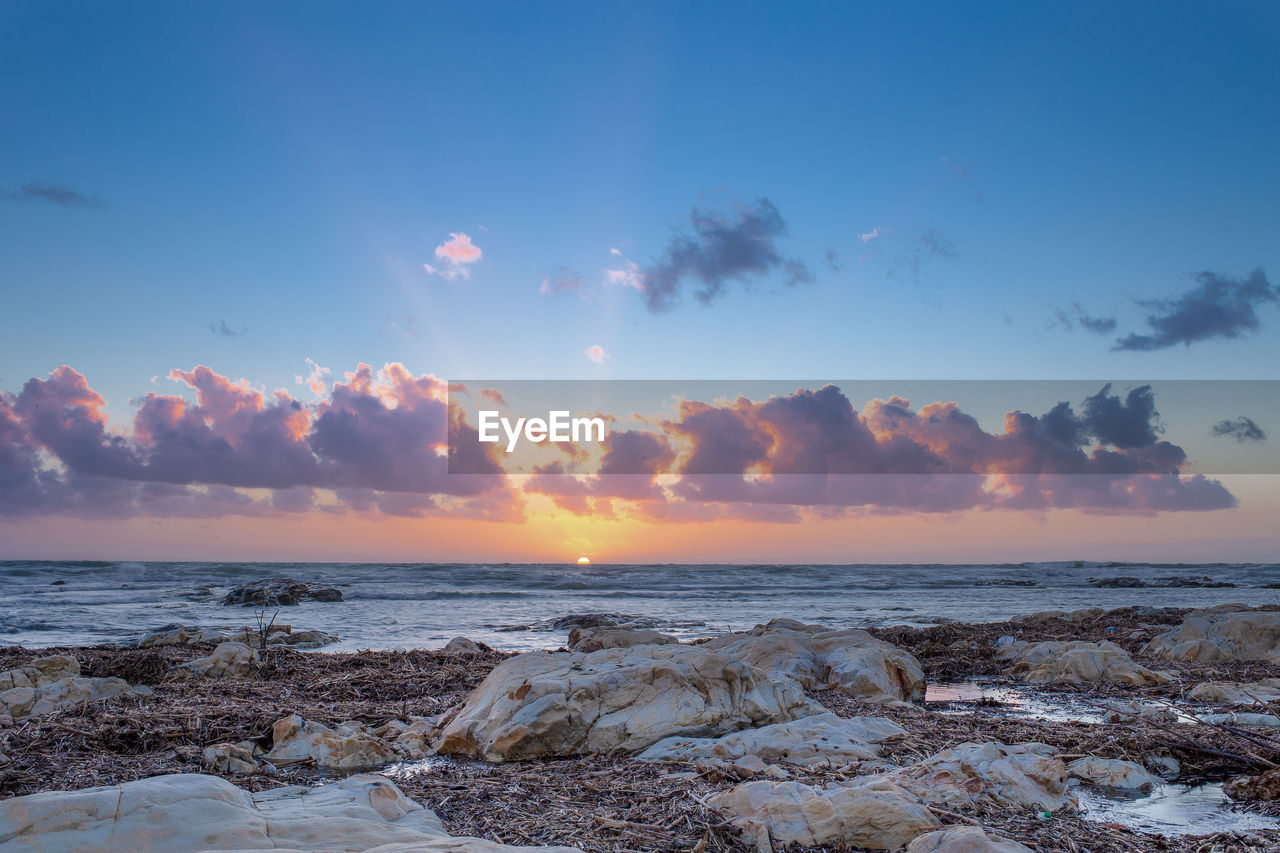 Scenic view of sea against sky during sunset