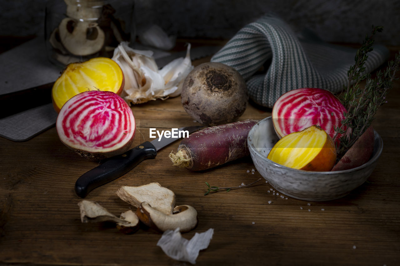 Yellow red orange beet with purple carrot and dry mushrooms