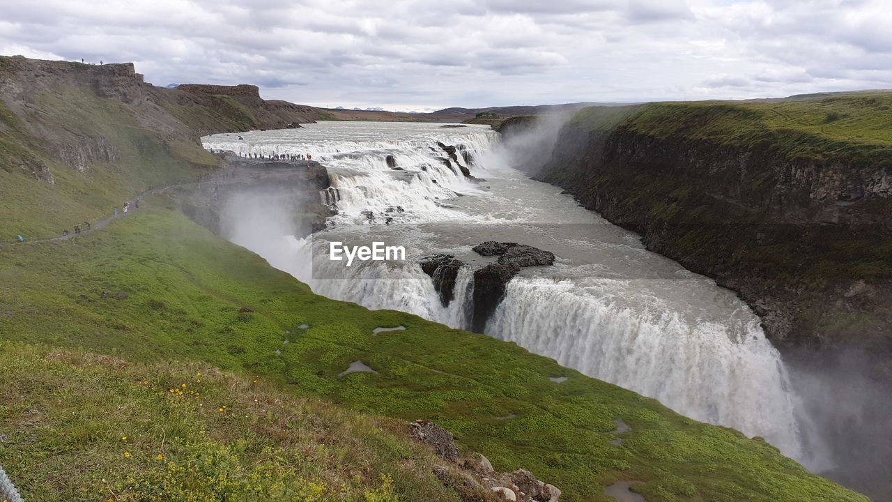 SCENIC VIEW OF WATERFALL IN SEA