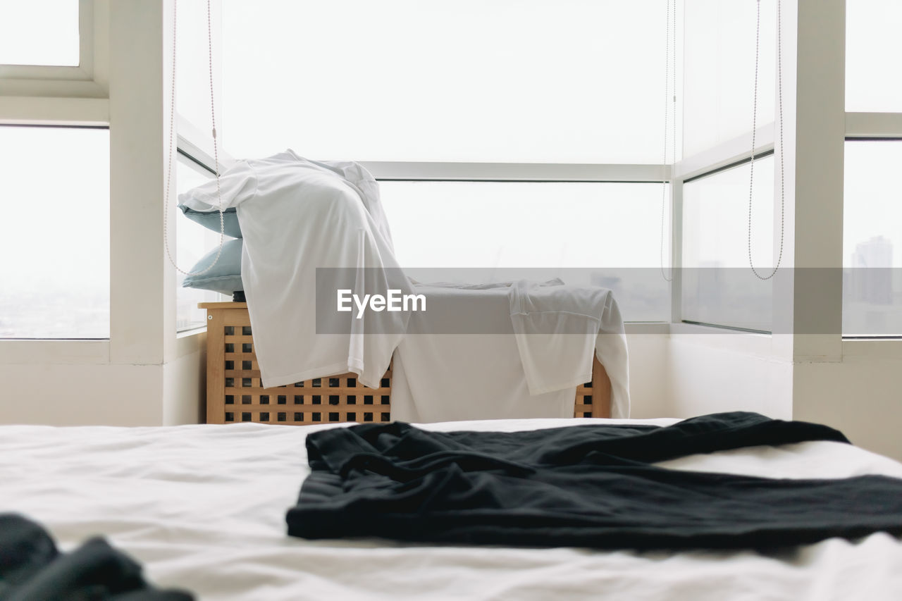 Clothes hanging on the table let dry on the balcony of an apartment.