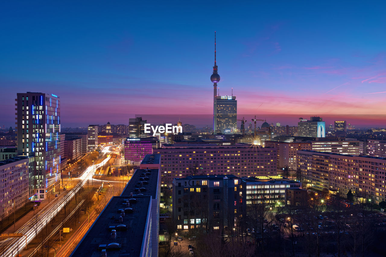 Aerial view of city lit up at night